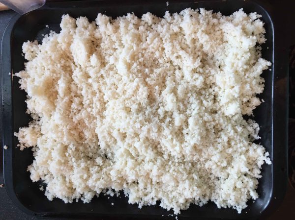 Spread out evenly on a baking tray and squirt with oil and add a sprinkle of salt.