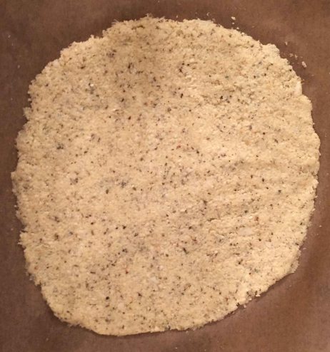 Creat a circular pizza base using the "dough".